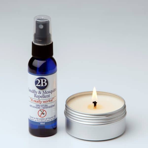 A bottle of Natural Insect Repellent and an insect repellent candle